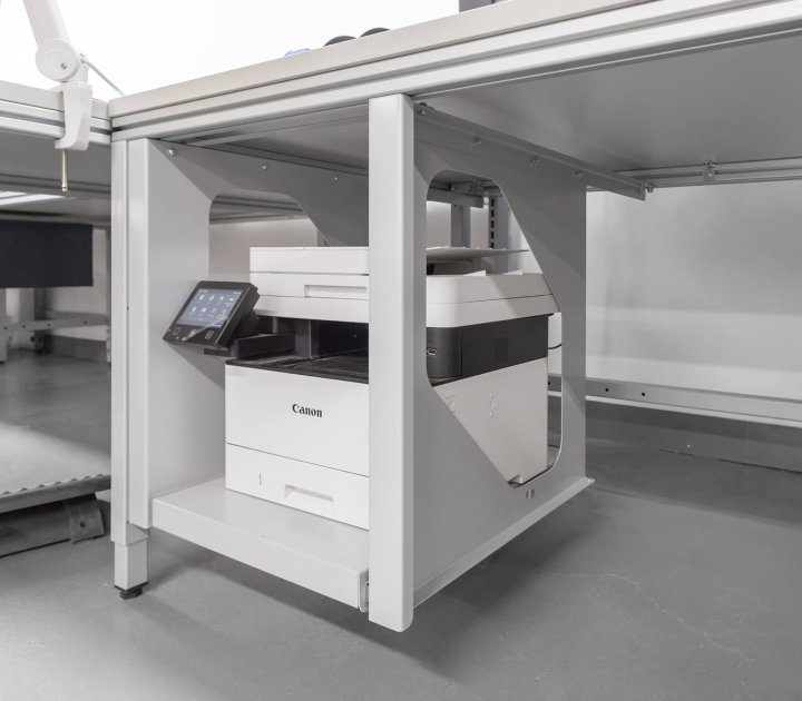 Pull-out printer tray under the table